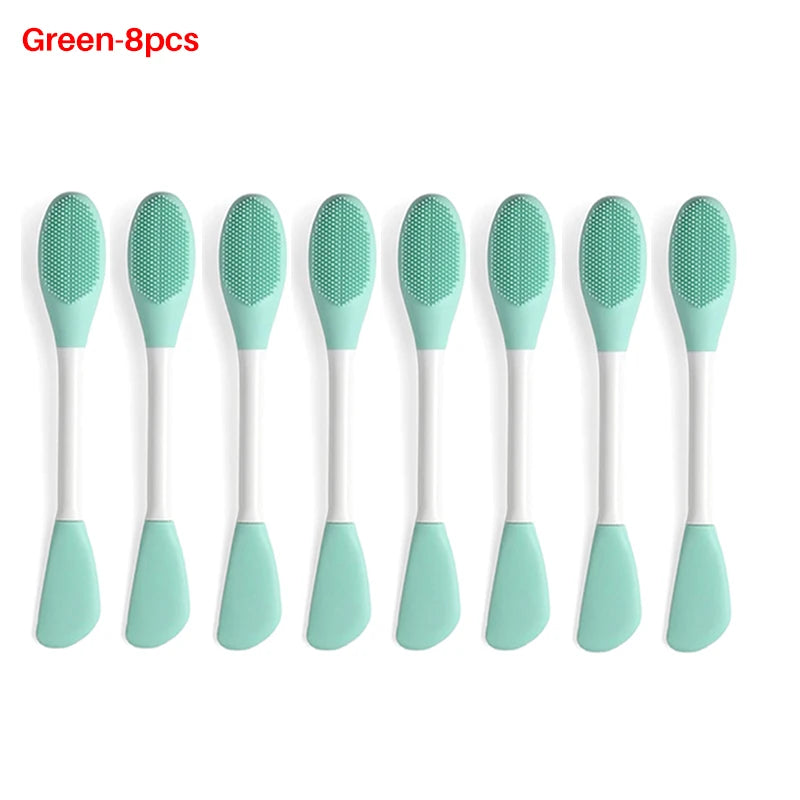 A set of eight green silicone facial brushes for exfoliation