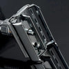 Close-up of a silver double edge safety razor with a butterfly opening mechanism.