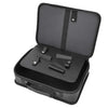 A black professional barber tool storage bag with a hinged lid and interior compartments.