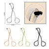 A set of mini stainless steel eyelash curlers in gold and black colors.