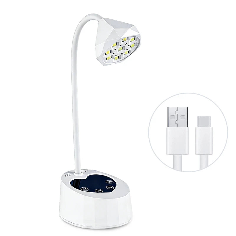 A white professional UV LED nail lamp with an adjustable arm and a light panel, shown next to its power adapter.