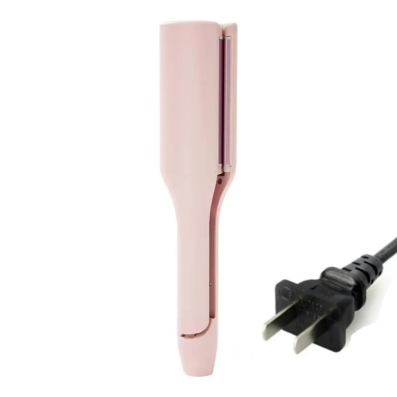 A pink professional ceramic hair curling iron with a black plug visible.