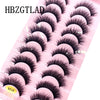 Un plateau en plastique rose présentant divers styles de faux cils de renard noirs.