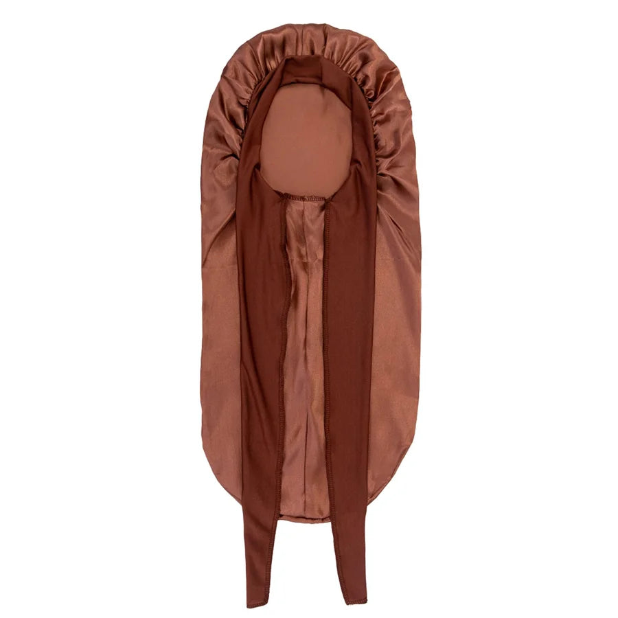 A brown satin silk hair bonnet cap displayed vertically.