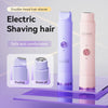 A pair of purple and pink double-head electric shavers are shown on a glass surface.