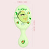 A light green cartoon mini air cushion massage comb with a crown design.