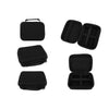 A set of black portable cases for hair clippers and trimmers, shown in various folded and open configurations.
