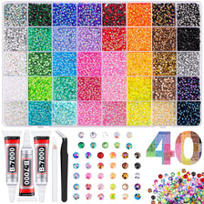 A collection of colorful rhinestone nail charms and glitter for crafting and decoration.