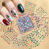A hand holds a clear plastic package of Christmas Santa Claus 3D nail art stickers with glitter designs on a light background