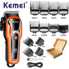 Orange and black Kemei professional cordless hair trimmer with various guard attachments and accessories