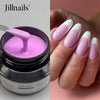 Produit de construction en gel de Jillnails en pot à côté d'ongles manucurés montrant un vernis dégradé rose et blanc.