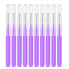 A set of precision eyebrow and lash brushes in purple packaging.