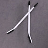 A pair of white dual-ended eyelash curlers and brow brushes are displayed on a gray surface.