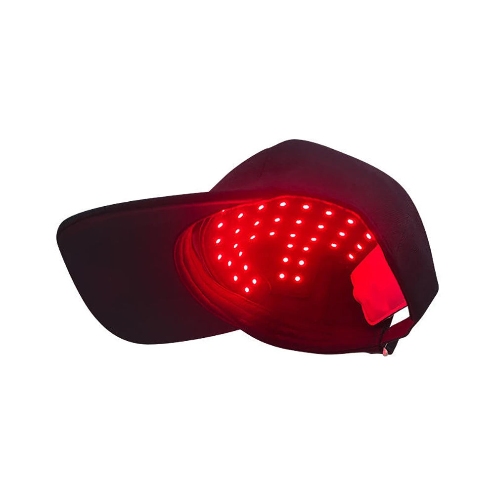 A black cap with an illuminated red light panel, designed for infrared red light therapy.