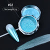 A small jar of bright blue holographic chrome nail glitter powder with a swatch on a black background.