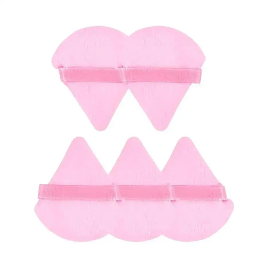 Pink triangular powder puffs for flawless foundation application