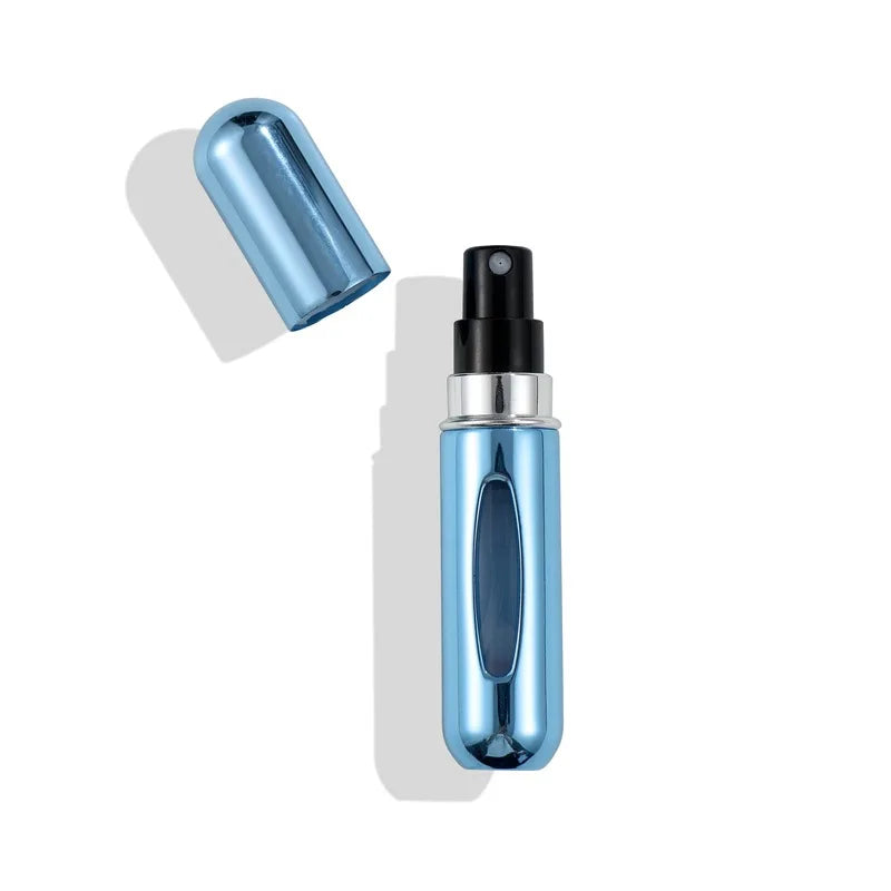 A sleek, metallic blue portable mini perfume refill spray bottle with a black cap and a silver collar.