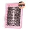 Pink lash curler tool with numerous thin black lashes for decorating beauty