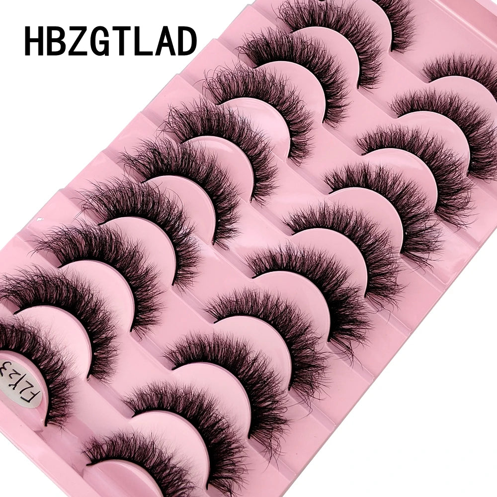 A pink plastic tray holding 10 pairs of black false mink eyelashes for cosmetic use.