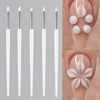A set of five white silicone nail art brushes for gel polish application shown in various angles.