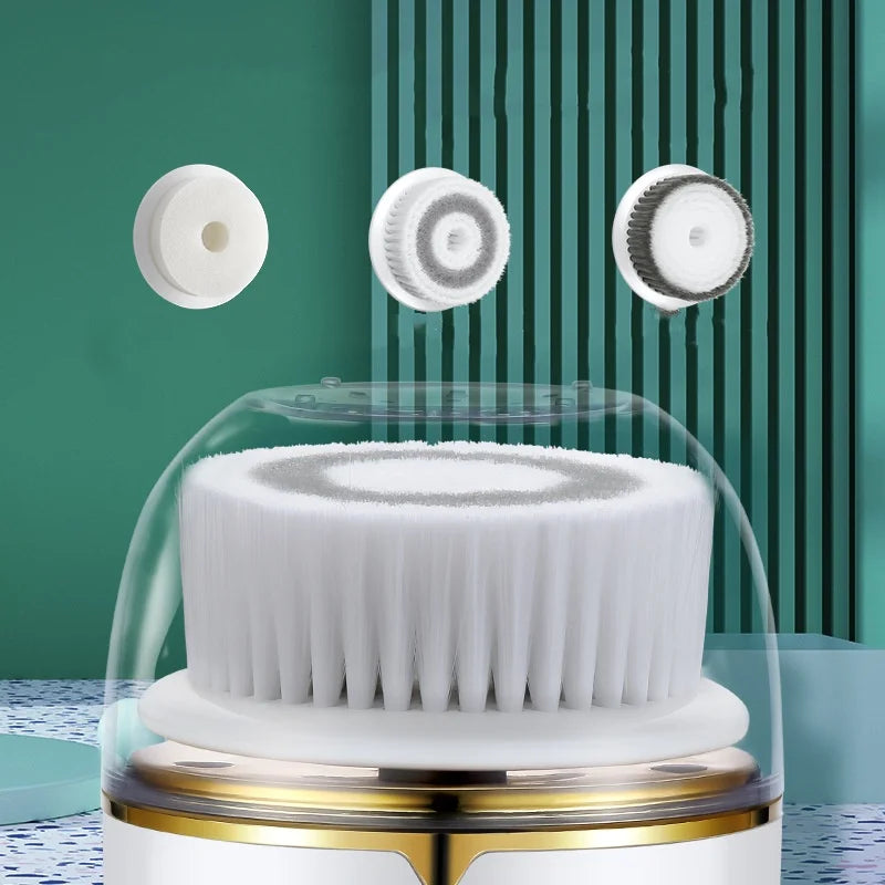 A white electric facial cleanser brush is shown with several interchangeable silicone brush heads and a clear protective dome
