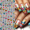 Close-up of fingers decorated with colorful flower and butterfly nail stickers for DIY manicure