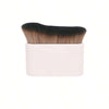 Cepillo portátil de bronceado corporal rosa con cerdas oscuras.