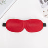 A bright red 3D sleep mask designed for light blocking is shown on a white surface.