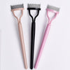 Three precision metal eyelash separators and curlers in pink, black, and light pink.
