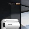 A white GMDQ high power hair dryer is shown in a close-up against a dark background.
