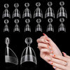 A collection of medium clear almond acrylic nail tips displayed on a black background.
