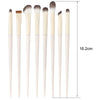 A set of natural makeup brushes shown standing upright with a measurement scale.