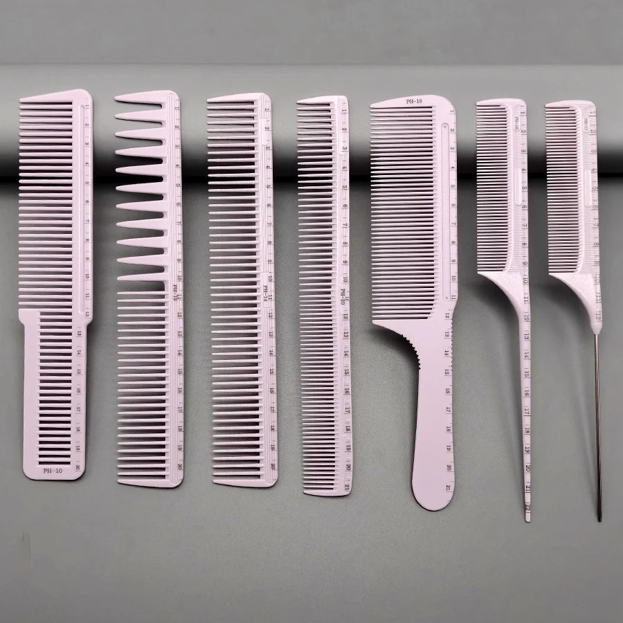 A set of seven white professional hair styling combs displayed in a row on a gray surface.