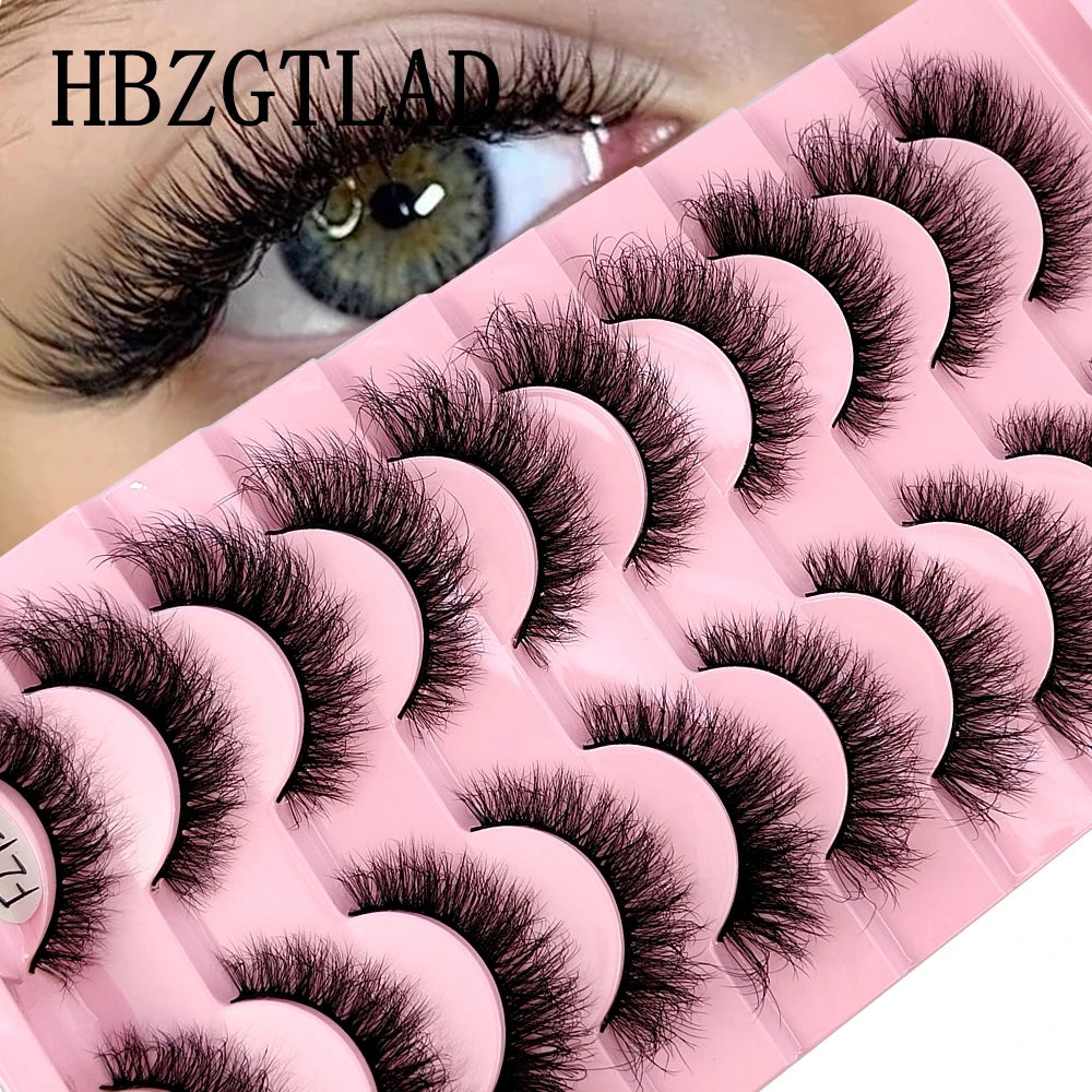 A pink lash tray with 10 pairs of natural look false mink eyelashes displayed on a model's eye.