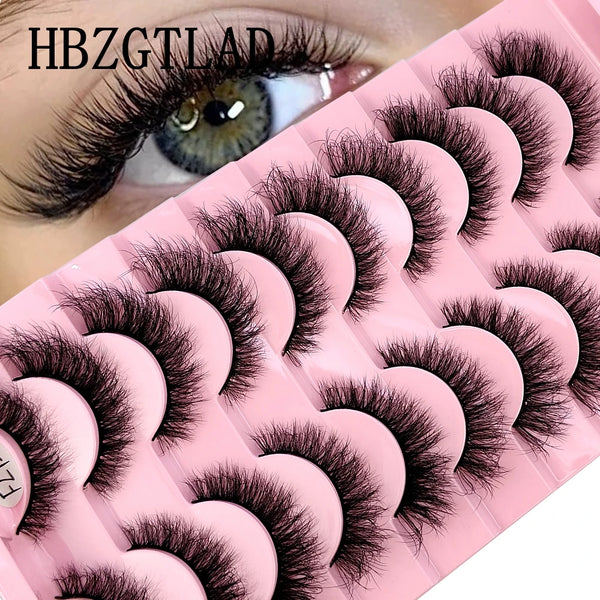 A pink lash tray with 10 pairs of natural look false mink eyelashes displayed on a model's eye.