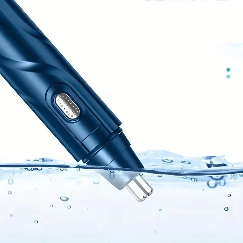 A close-up of a blue electric nose hair trimmer submerged in clear water.