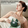 A woman is holding a green deep tissue shiatsu massager for neck and shoulder relief.