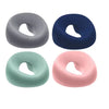 Three ergonomic memory foam prone pillows in gray, navy blue, and pink.