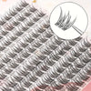 A close-up view of natural 12mm DIY tufted eyelash extensions showing the curl and application technique.
