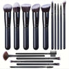 A collection of professional makeup brushes and tools in black and gray.