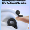 A black silicone ear plug is shown being inserted into the opening of a white plastic object.
