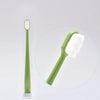 A light green ultra-soft microbristle toothbrush is shown next to a magnified view of the brush head.