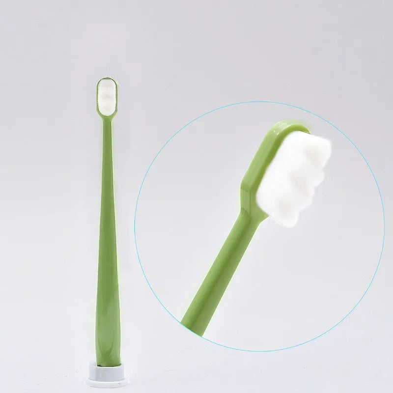 A light green ultra-soft microbristle toothbrush is shown next to a magnified view of the brush head.