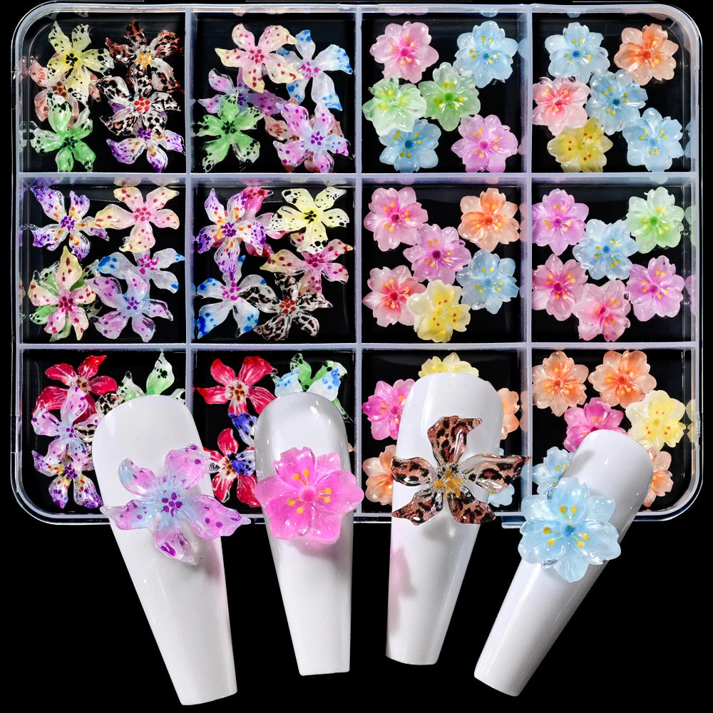 A set of floral resin nail charms featuring various colors and patterns of hibiscus flowers.