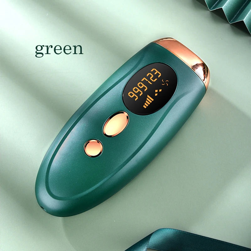 A green painless electric hair removal epilator device with a rose gold accent, shown on a light green surface.