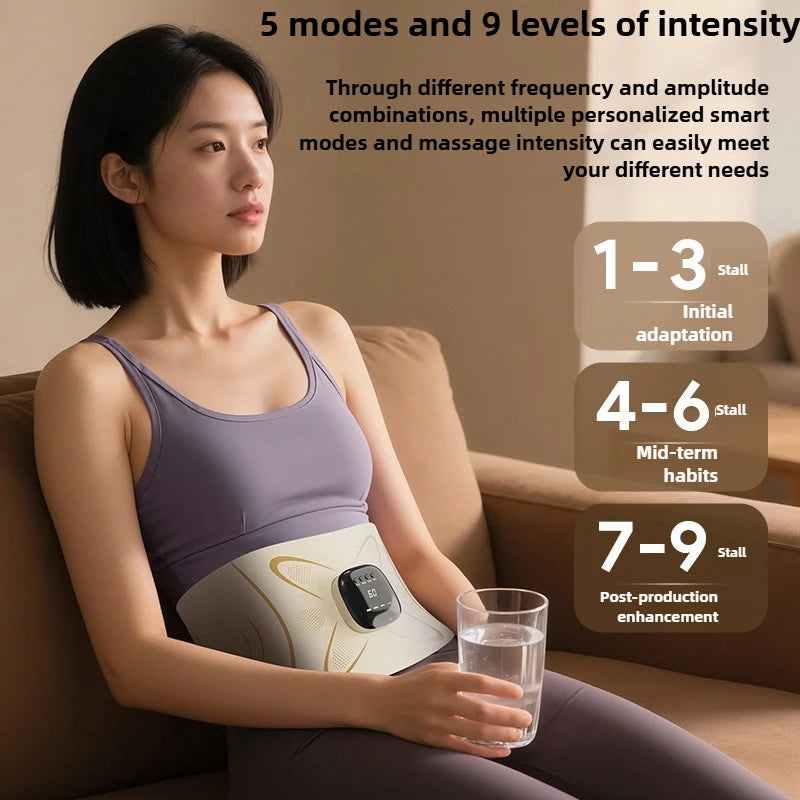 A woman is using an EMS waist pulse massager for body shaping device on her abdomen while sitting on a couch.
