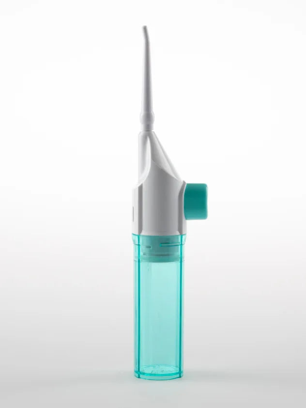 A manual high-pressure dental flosser with a white body and a clear blue reservoir.