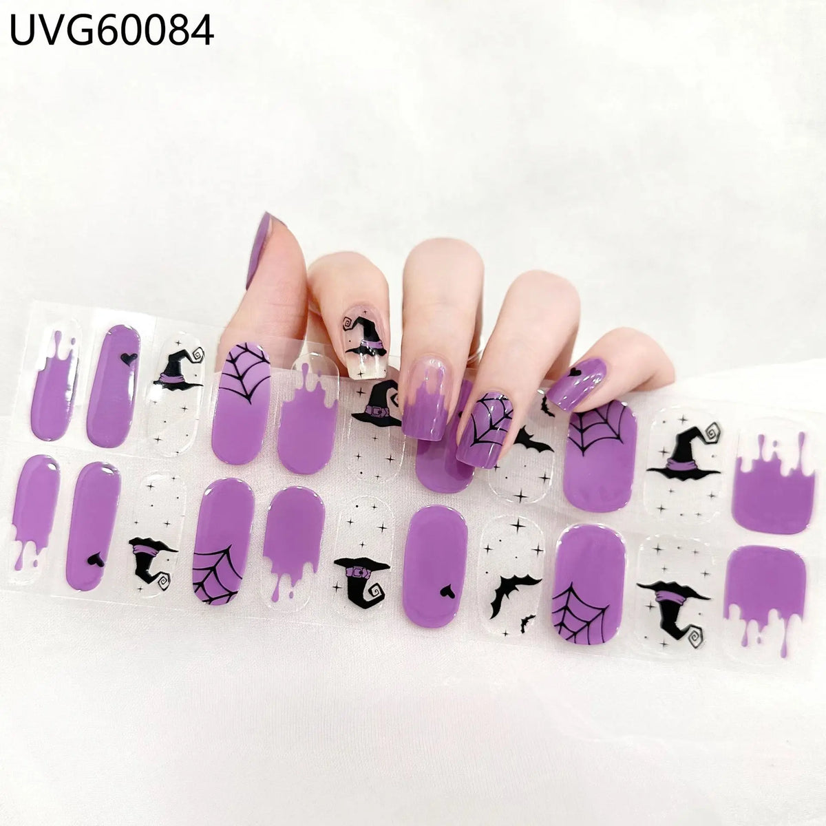 UV gel nail stickers featuring purple and black Halloween designs on fingernails