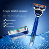 A blue manual shaver with a 5-layer scratch-resistant head is shown above water droplets.