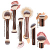A set of MAANGE makeup brushes including powder, blush, and foundation brushes shown in various angles.